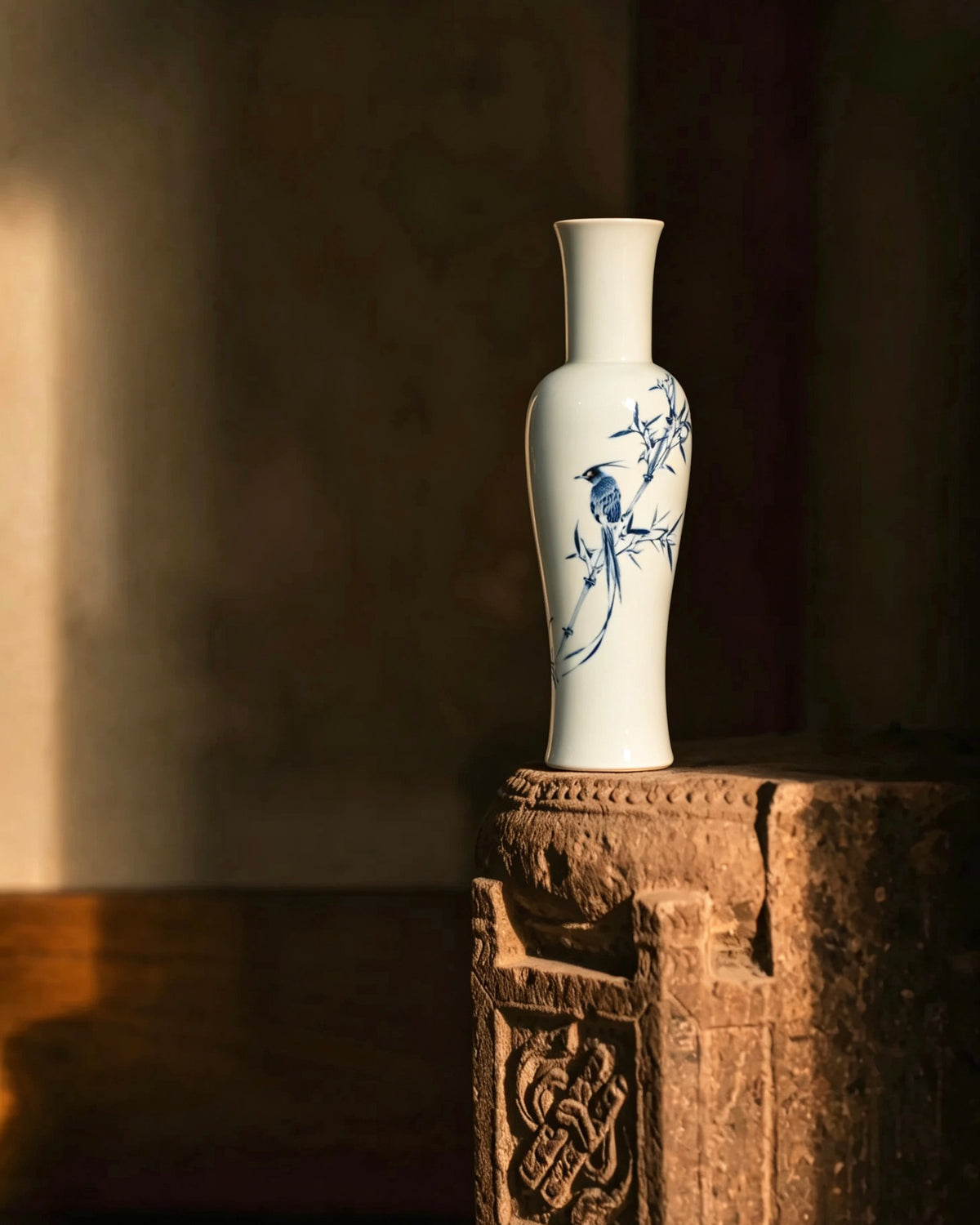 Side angle view showing graceful slender neck and flared opening of ceramic vase