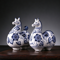 Blue-and-white Tang horse pair hand-formed from kaolin clay with underglaze floral painting