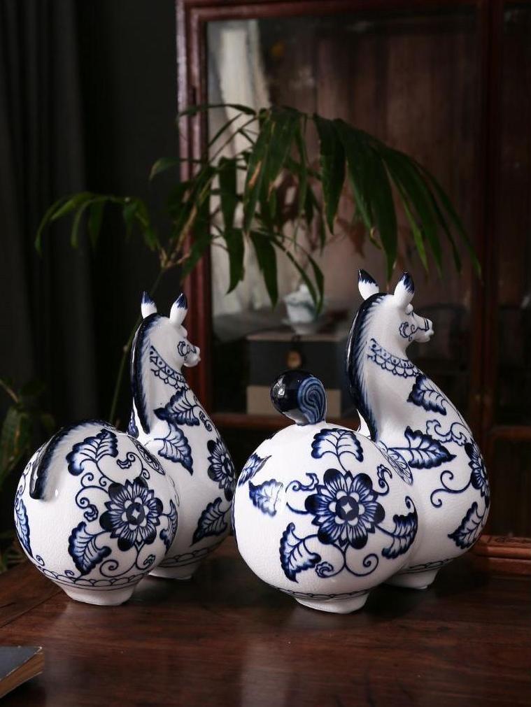 Chinese ceramic horse pair with rounded forms raised heads and balanced proportions