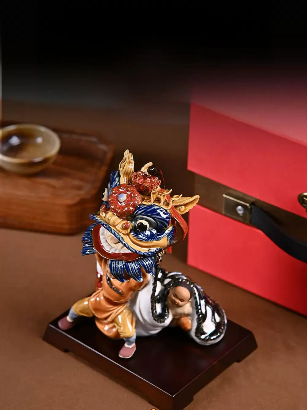 Traditional dancing lion pottery sculpture, symbolizing perseverance, oriental folk art ornament for home display