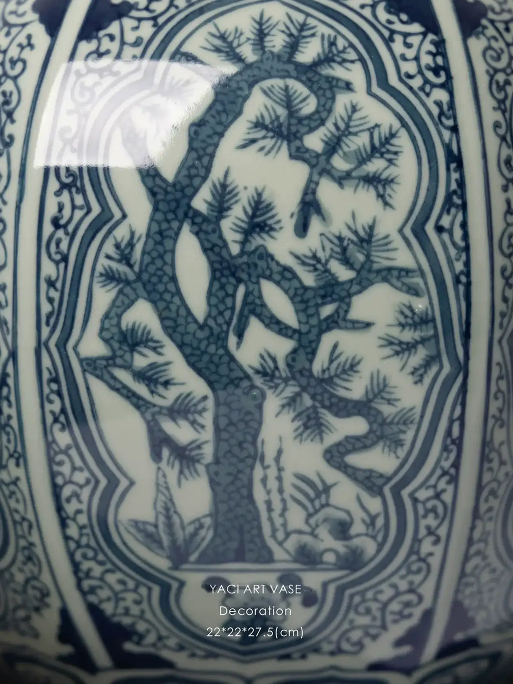 Chinoiserie-inspired blue and white porcelain vase with botanical motifs