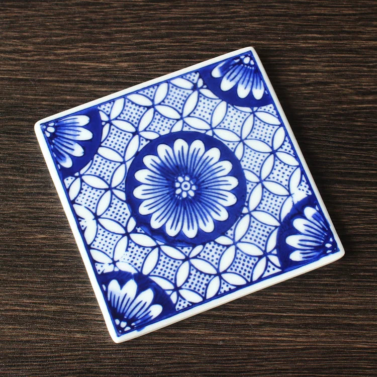 Cobalt blue hand-painted tile with rounded corners and stable flat base for tea table use