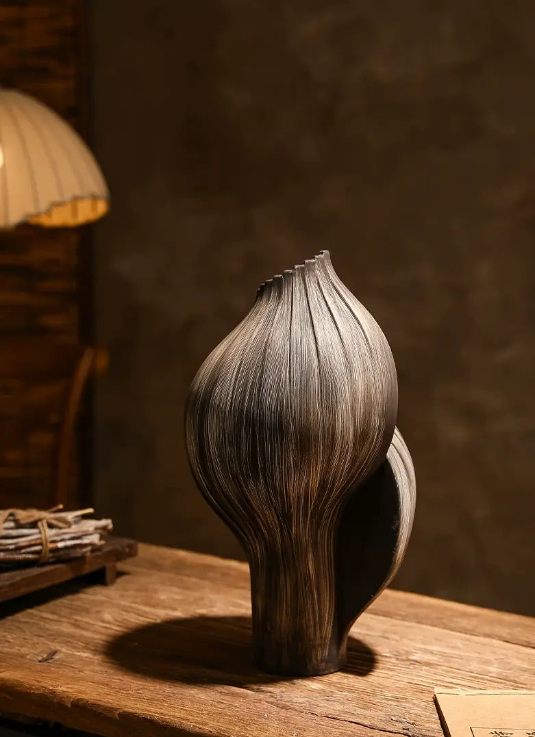 Sculptural ceramic vase designed as both a functional flower vessel and decorative art object