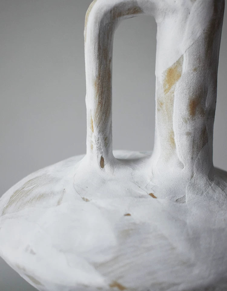 Rough pottery handle vase placed on dark wood table, vintage ceramic decor for space styling