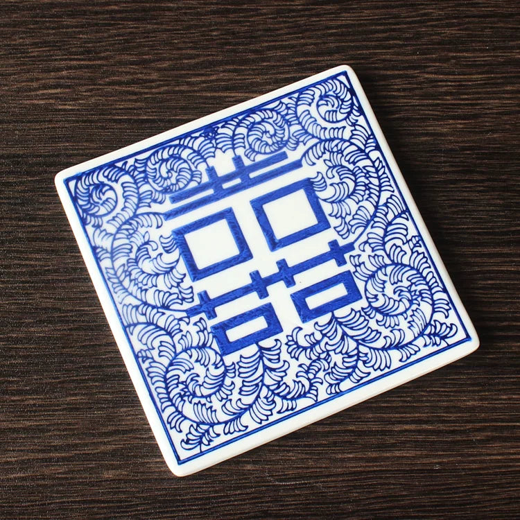 Glossy glazed square tea coaster protecting table surfaces from heat and moisture