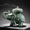 Green glaze ceramic elephant incense censer with carved lotus lid, traditional oriental art vessel for coil incense, tea room and meditation decor