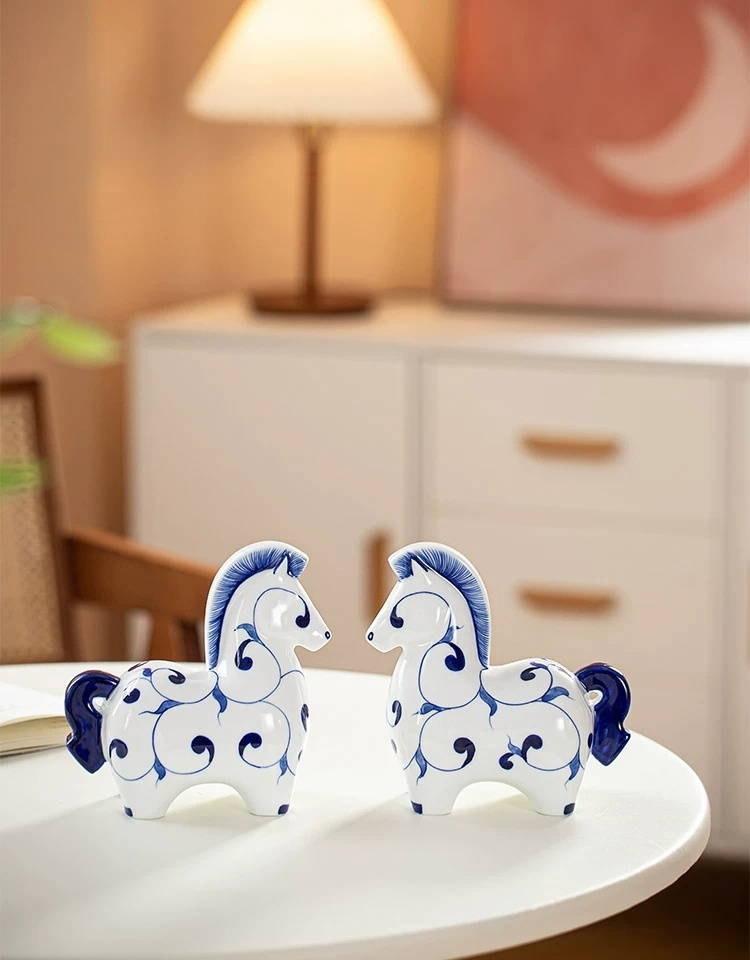 Cute rounded ceramic horse statue, classic blue and white hand-drawn motifs, artistic shelf decor for oriental style interior