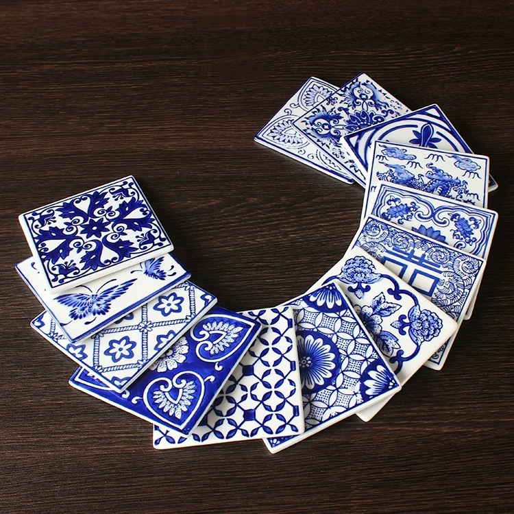 Hand-painted cobalt floral tile on white porcelain with traditional Chinese vine and blossom design