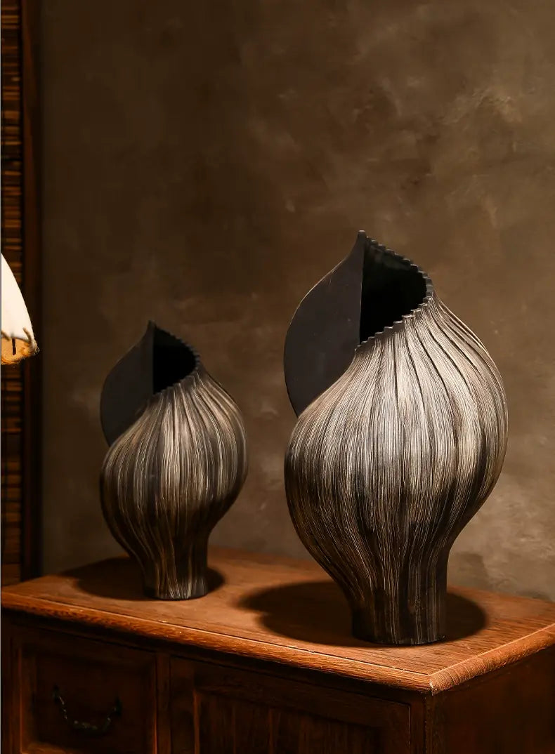 Hand-thrown ceramic vase made from coarse black clay with a deep ink-toned finish