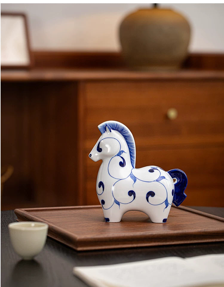 Artistic ceramic horse statue with hand drawn blue swirls, auspicious cultural symbol, thoughtful gift for art and craft enthusiasts