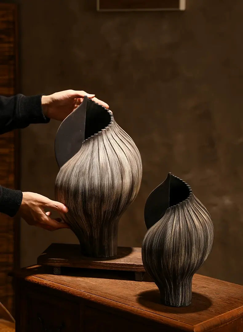 Large and small organic ceramic vases designed as complementary sculptural accents