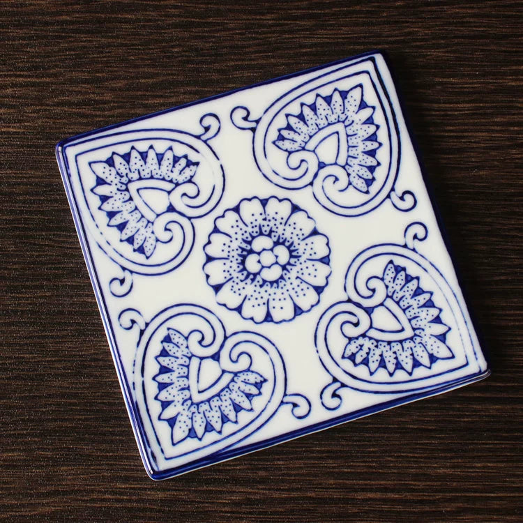 Ming-style blue-and-white coaster with classic floral medallion and vine border design