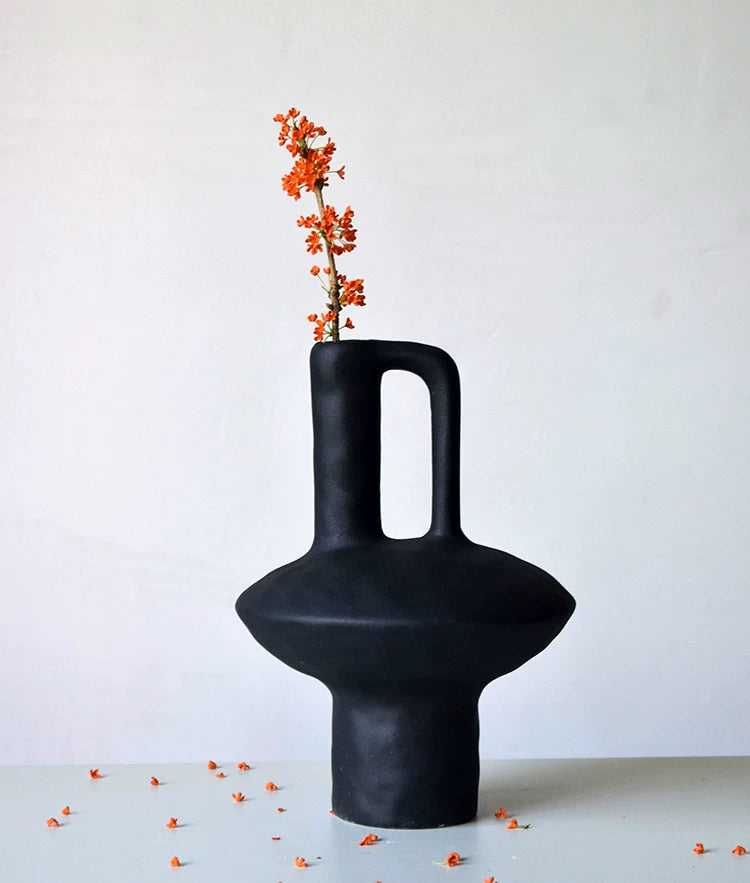 Mottled glaze ceramic vase with hollow handle, hand-thrown pottery decor for modern interior