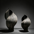 Organic sculptural ceramic vase with an asymmetrical leaf-inspired opening