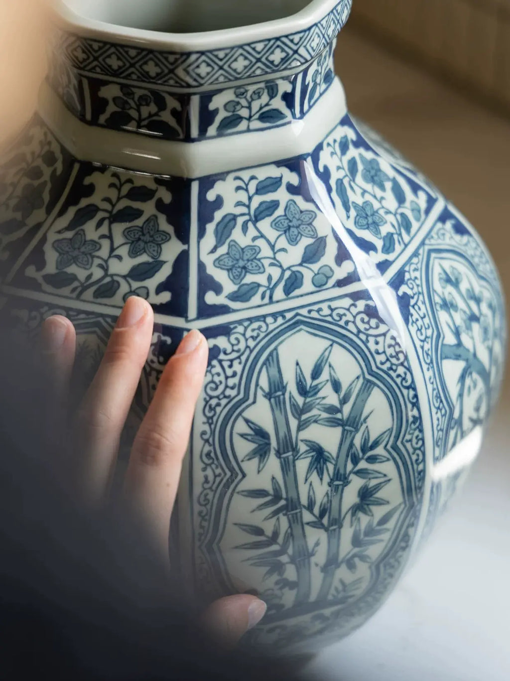 Oriental blue and white ceramic vase with traditional decorative patterns
