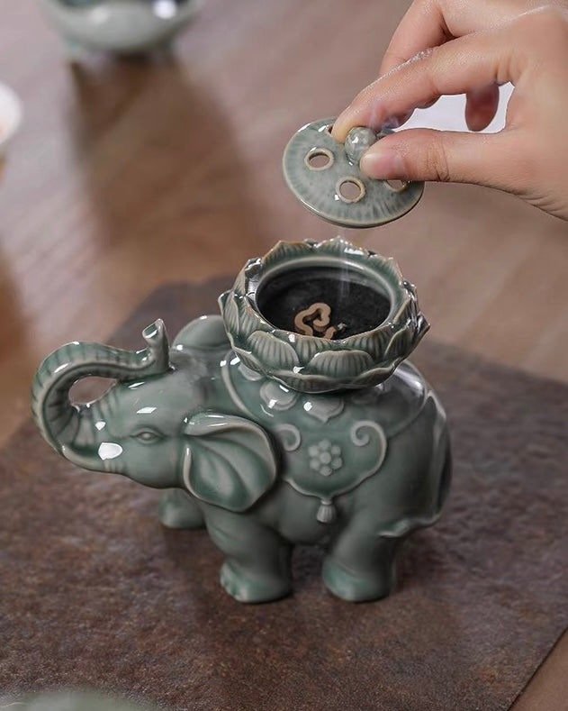 Oriental elephant ceramic censer for tea ceremony, detailed lotus carving, functional coil incense burner with peaceful cultural charm
