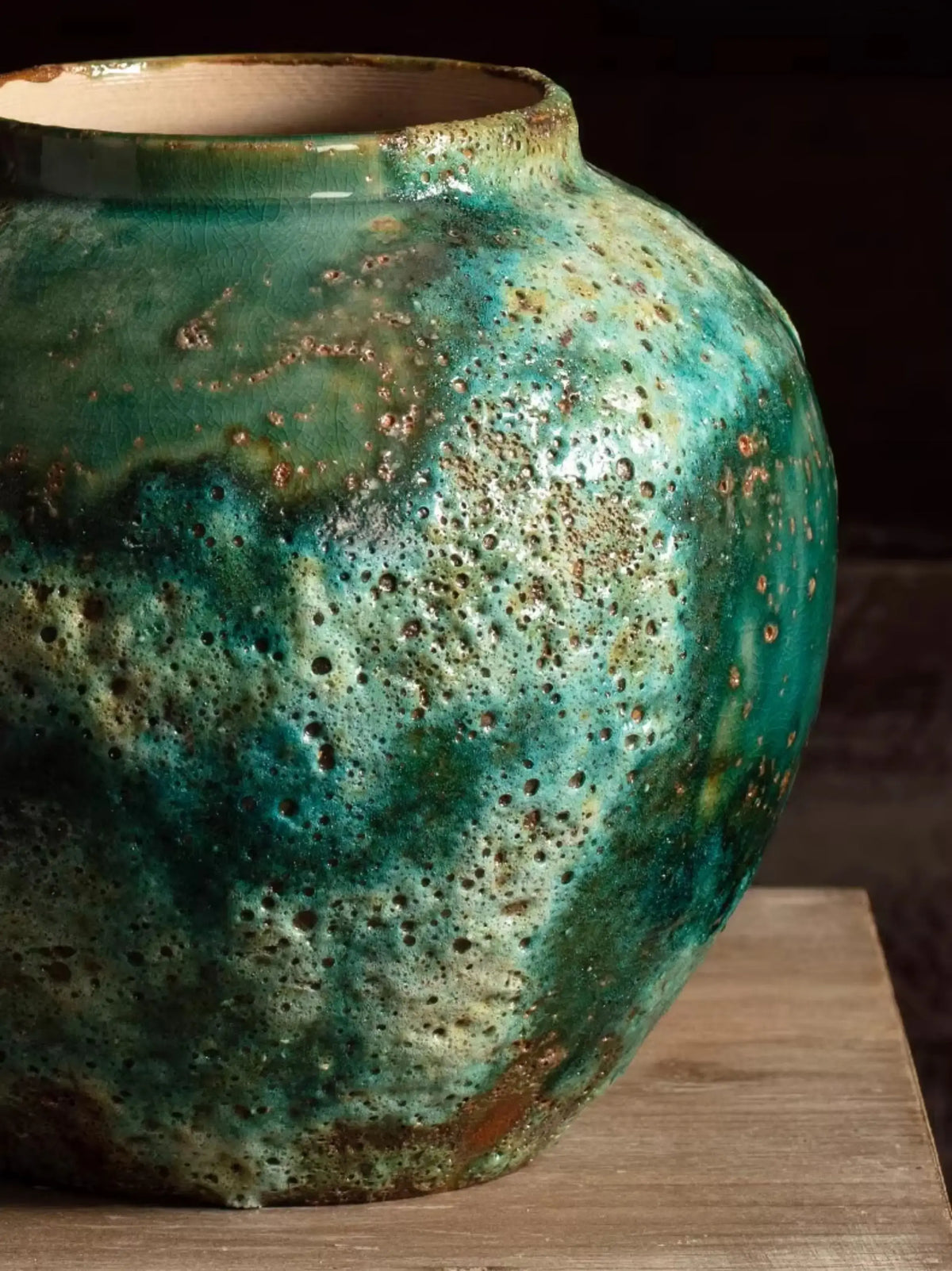 Small crater textured green ceramic vase, perfect accent for wabi sabi interior design