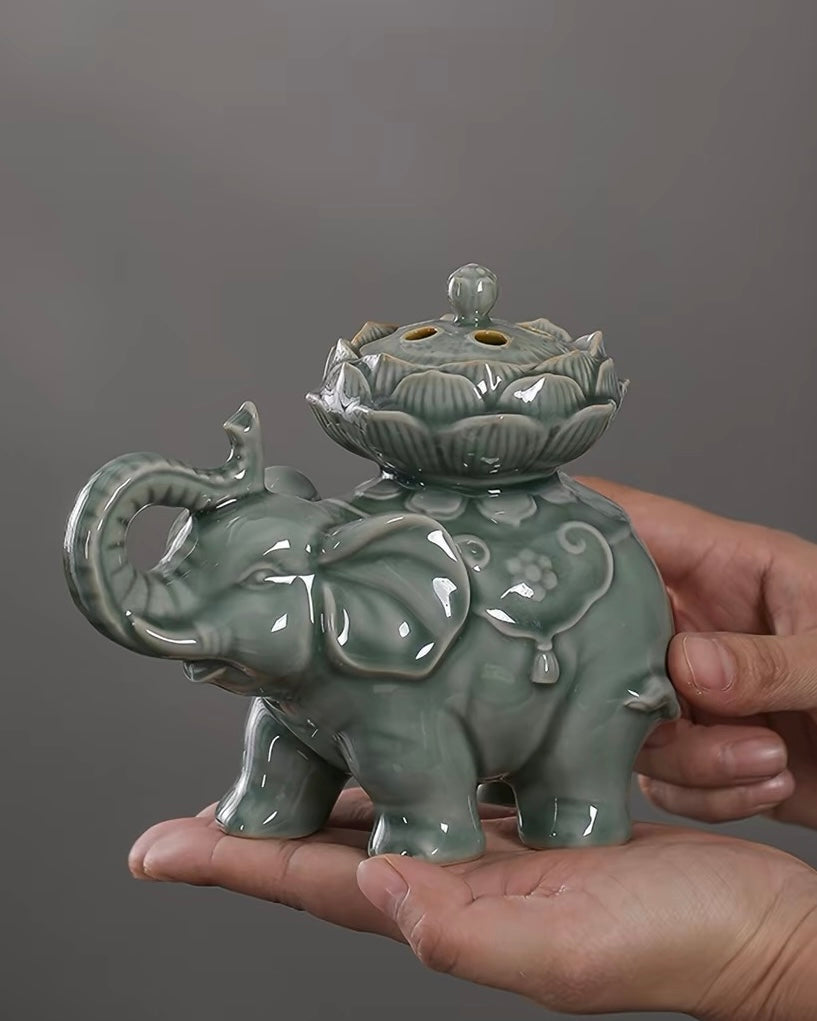 Tabletop oriental incense vessel sculpted as an elephant with lotus bloom lid, designed for coil incense, serene home aesthetic ornament