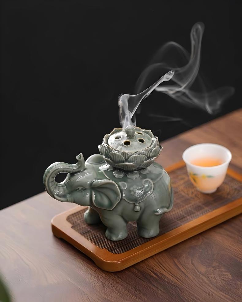 Tranquil meditation ceramic incense burner, elephant symbolizing good fortune and lotus representing purity, bean green glazed tabletop art piece