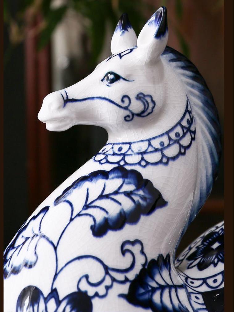 Underglaze blue floral horses showing fluid brushwork and stable color on white porcelain

